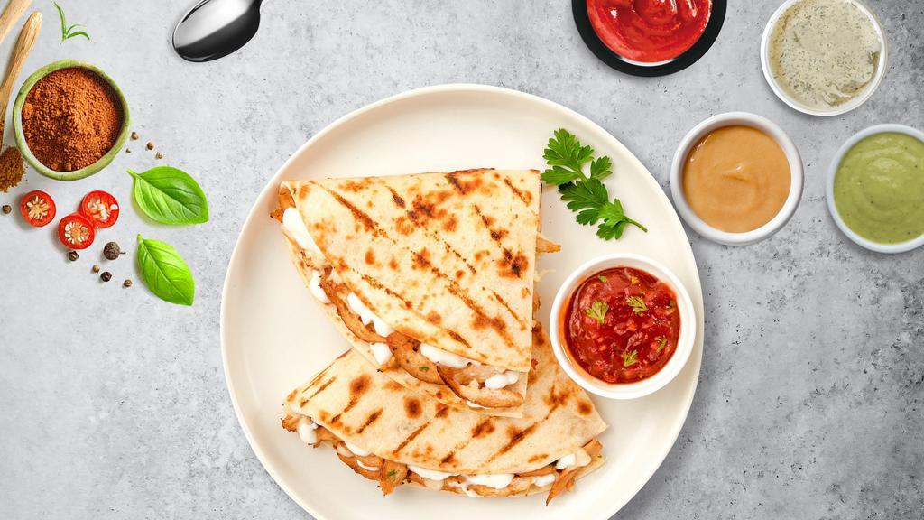 El Pollo Quesadilla · Chicken wrapped with cheese in a grilled tortilla