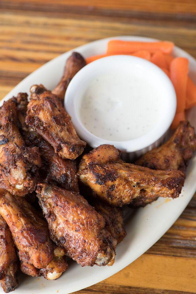 Chicken Wings. · pound of baked spicy wings, baby carrots & blue cheese dressing
