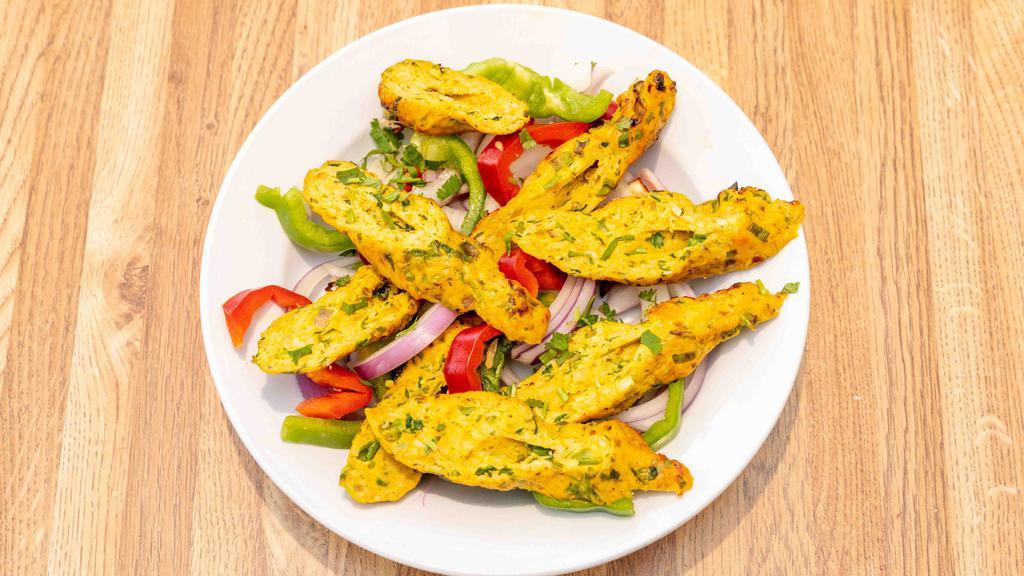 Chicken Seekh Kabab · Ground minced chicken with mixture of spices onto skewers and grilled.