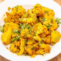 Aloo Gobhi · Popular Indian dish fresh cauliflower and potato cooked with onions, tomatoes and spices.