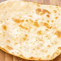 Naan · Soft Indian-style flatbread traditionally baked in clay oven.