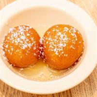 Gulab Jamun · Delicate fried milk balls in sugar syrup.