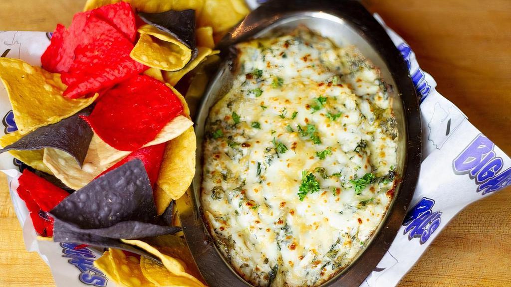 Spinach Dip · Spinach, artichoke hearts & loads of cheese. warm tortilla chips on the side.