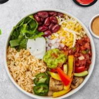The Veggie Bowl · Vegetarian fajitas burrito bowl served with crema, pico de gallo, avocado slices and shredde...