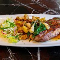 Maiale · grilled pork chop, roasted yukon gold potatoes, treviso radicchio, ramps, aceto balsamico