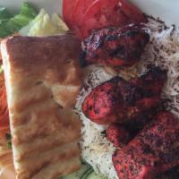 Chicken Kabob · Charbroiled chicken breast marinated with peeled garlic, spices, lemon juice.