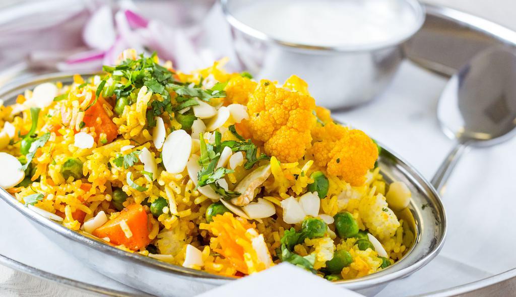 Vegetable Biryani · Assorted of vegetables mixed with saffron flavored basmati rice.