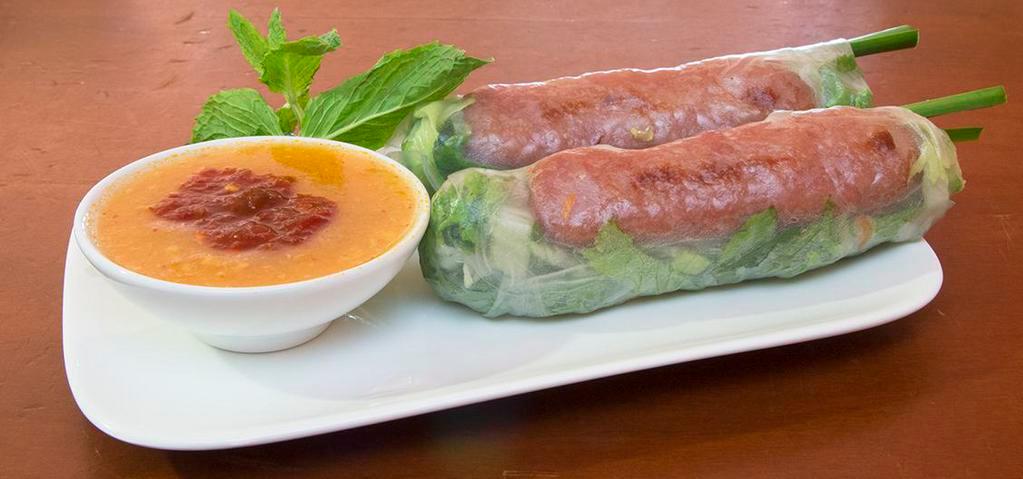 01. Nem Cuon (2 Rolls) · Two rolls. Grilled pork paste wrapped in rice paper with lettuce, cucumber, carrot, daikon, and mint.