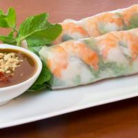 04. Goi Cuon (2 Rolls) · Two rolls. Steamed shrimp and pork wrapped in rice paper with vermicelli, lettuce, mint and ...
