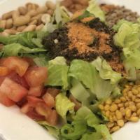 Tea Leaf Salad · Burmese dish. Mix of fermented tea leaves, fried garlic, peanuts, sesame seeds, sunflower se...