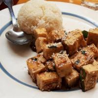 Sesame Orange Tofu · Deep fried tofu in spicy sweet and tangy sauce, topped with roasted sesame seeds.