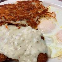 COUNTRY FRIED STEAK · Served 2 eggs choice of hash browns, home fries and toast
