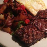 12 OZ. NEW YORK STEAK AND EGGS 1 · Served with 2 eggs choice of Hash browns or home fries and toast.