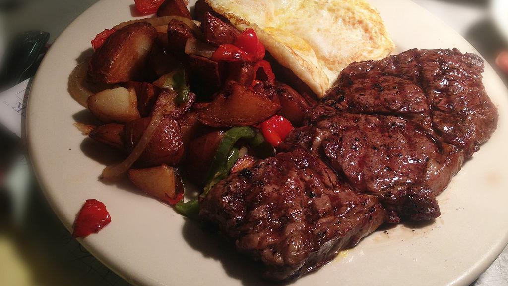 12 OZ. NEW YORK STEAK AND EGGS 1 · Served with 2 eggs choice of Hash browns or home fries and toast.