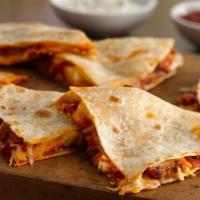 CHICKEN QUESADILLAS · Chicken quesadilla served with chips, avocado and salsa
