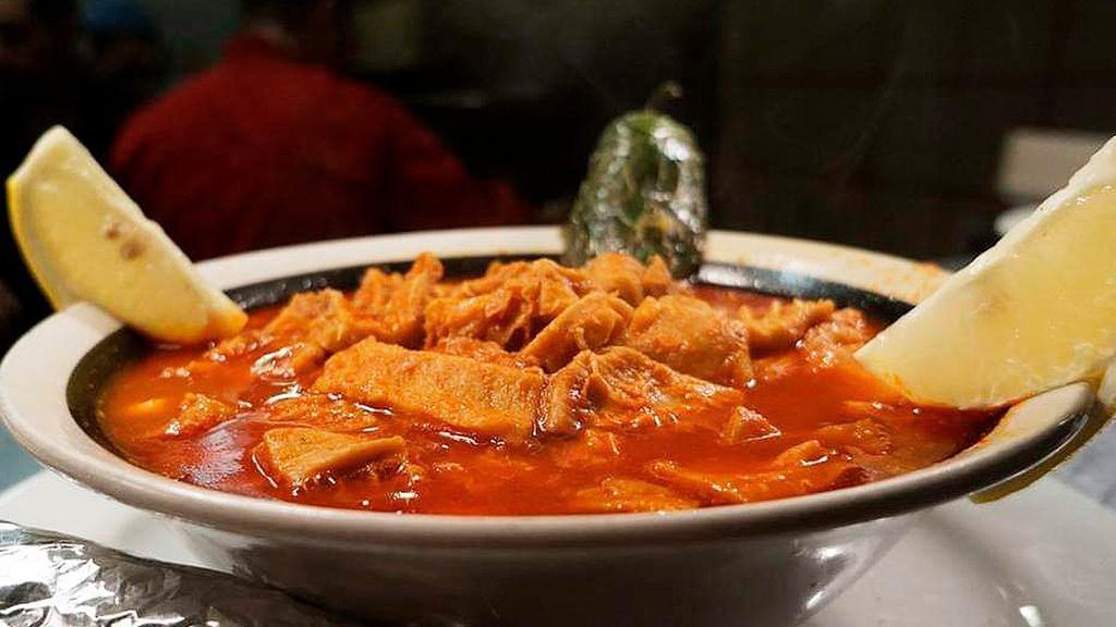 MENUDO · Honey combo pork tripe in a red chilli broth served with choice of feed feet and / or hominy and tortilla