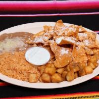 Chilaquiles Rojos o Chilaquiles Verdes · Warm Chilaquiles red or green sauce with rice, beans, and tortillas