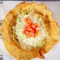 Taco Salad · Choice of meat, beans, guacamole, sour cream, cheese, lettuce, tomatoes, cilantro and onions...
