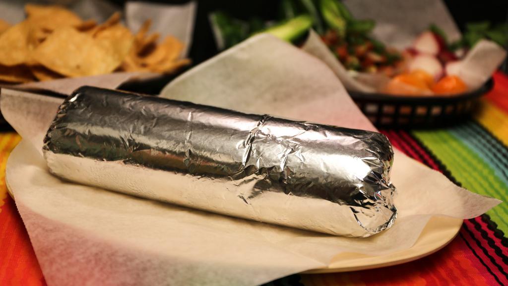 Super Burrito · Rice, beans, salsa, guacamole, sour cream, cheese and your choice of meat.