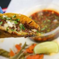 Quesabirria · Melted cheese on a corn tortilla, marinated beef, onions, cilantro. Consome Dip and pickled ...