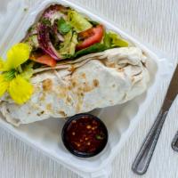 Chicken Shish Kabab Wrap · Marinated grilled chicken cubes with tomatoes, lettuce, onions, pickled vegetables, tahini a...