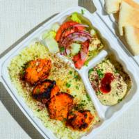 Chicken Shish Kabab Plate · A skewer of marinated chicken cubes.