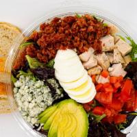 Cobb Salad · Chopped romaine and spring mix. Diced tomatoes, crisp bacon, sliced hard-boiled egg. Avocado...