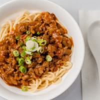 35. Dan Dan Yimein · Spicy ground pork, cilantro and noodles.