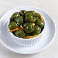 Olives · Marinated warm olives.