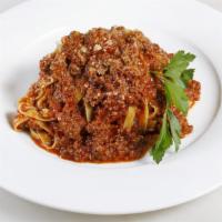 Tagliatelle Bolognese · Parmesan, ground beef, and tomato sauce.