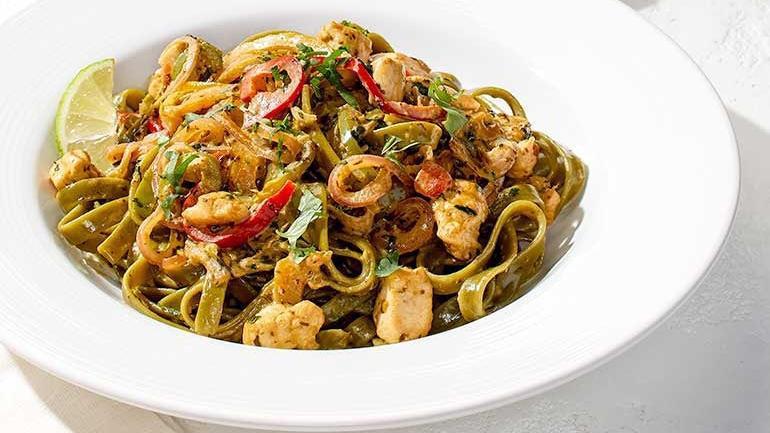Chicken Tequila Fettuccine · Our creamy jalapeño lime sauce with spinach fettuccine, red onions, bell peppers and fresh cilantro.