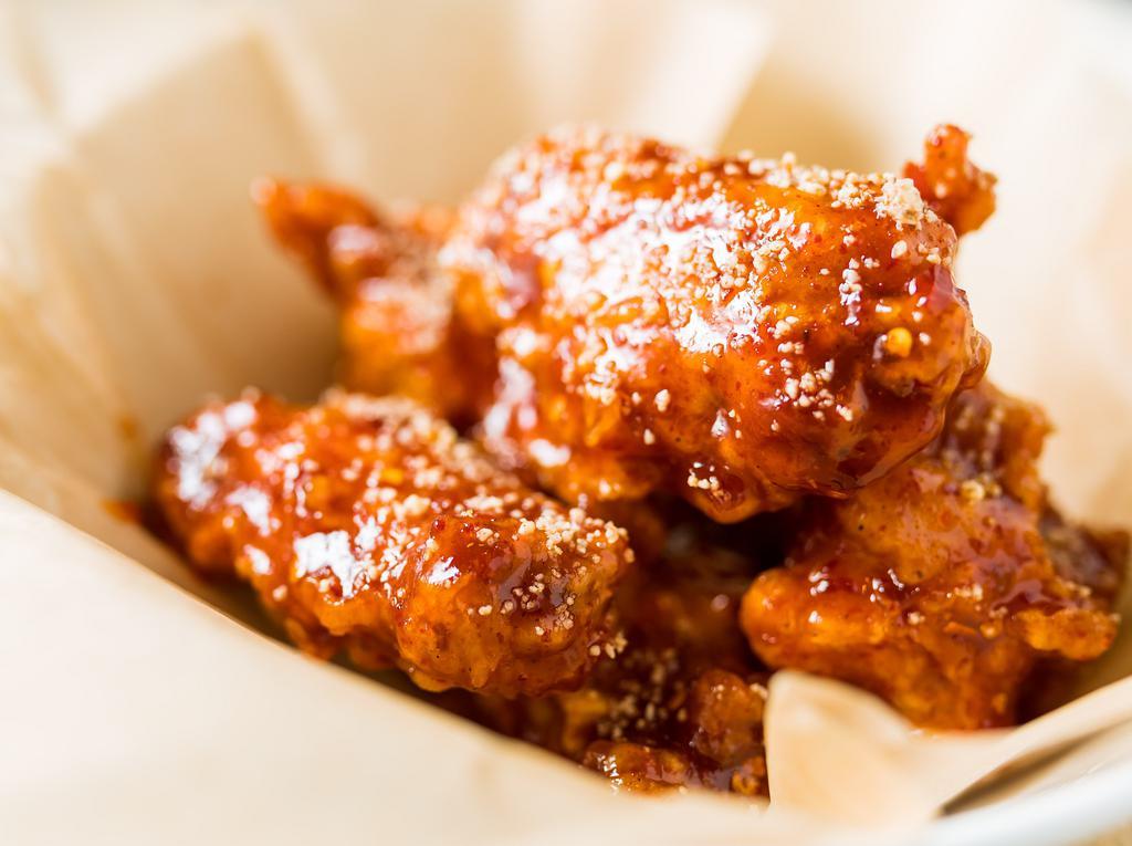 Chicken Wings · Deep fried chicken wings, soy garlic or sweet & tangy chili sauce, and almonds