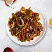 Mighty Mongolian Beef · Sliced beef stir-fried with white and green onions in a Mongolian sauce over a bed of crisp ...