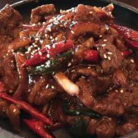Mongolian Beef · Marinated flank beef, scallion, onions, fresno chile, and a side of jasmine rice!