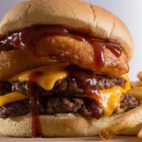 Rodeo Burger · A two-patty Texan delight. Topped with cheddar cheese, our signature crispy onion rings, and...