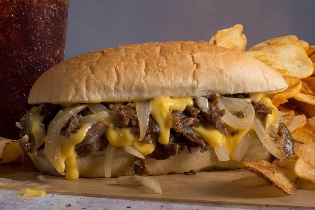 Cheesesteak · It's not just for Philly anymore. Melted American cheese topping shaved steak, accompanied by juicy grilled onions.