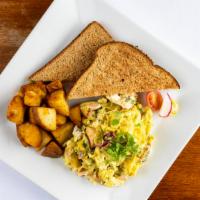 Salmon Scramble · An organic two eggs scrambled with salmon, cream cheese, dill and green onion serve with you...