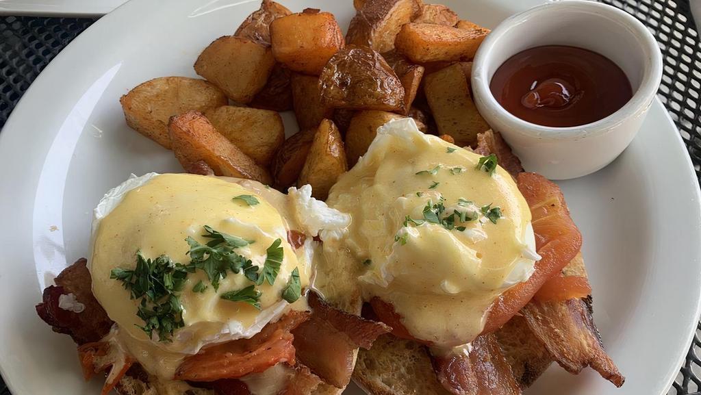 Wildcat Benedict · Delight fully prepared english muffins, garlic roasted tomatoes, bacon, two poached eggs and topped with hollandaise sauce.