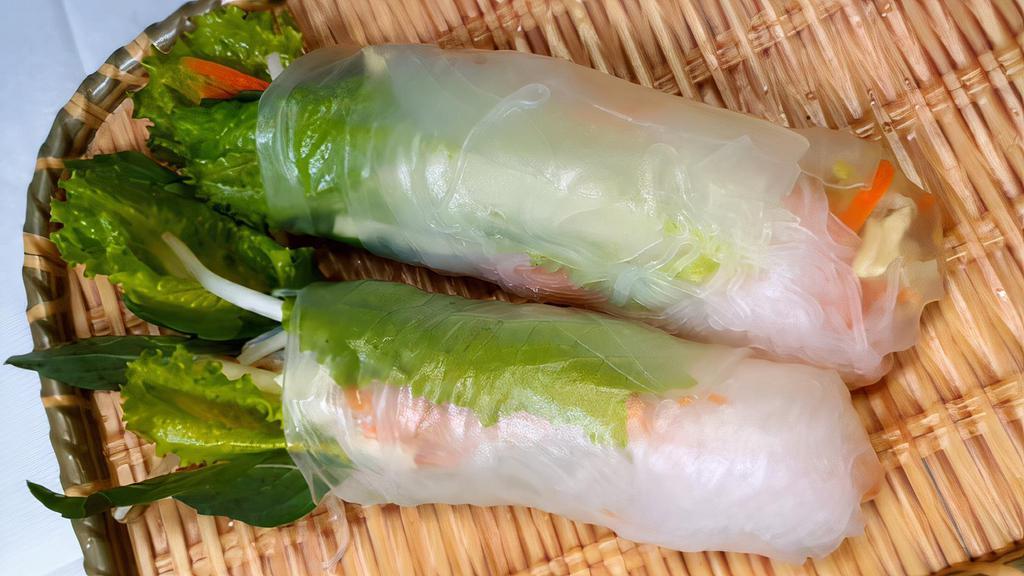 Crispy Spring Rolls · Deep fried crispy rolls wrapped with cabbage, carrots, silver noodle, fresh corn, taro, eggs, and sweet basil. Served with peanut sauce, sweet and sour sauce.