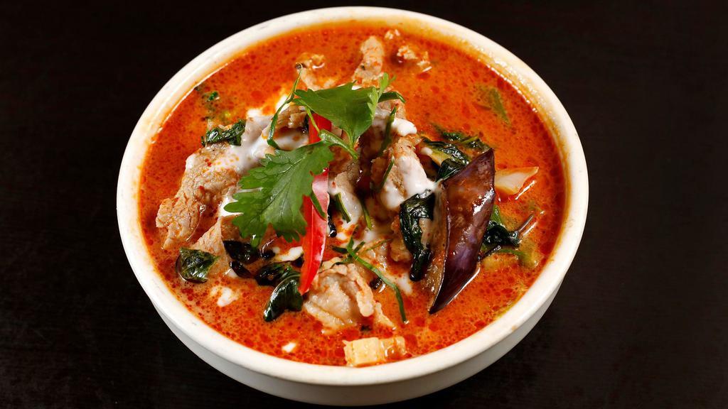 Red Curry · Bell pepper, eggplant, zucchini, bamboo shoots, and variety of vegetables simmered in red coconut milk red curry served with your choice of meat.