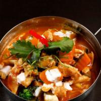 Pumpkin Curry · Chunks of pumpkin, sweet basil, and variety of vegetables simmered in coconut milk red curry.