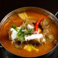 Lamb Curry · Chunks of lamb with potatoes, onions, and carrots simmered in yellow coconut milk curry.