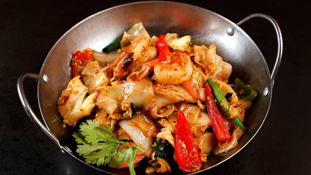 Drunken Noodle · Pan fried flat rice noodle with eggs, sweet basil, and mixed vegetables in fresh garlic chili sauce.