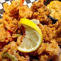 Calamari · fried with onions & bell peppers; choice of cocktail sauce or chipotle ranch for dipping
