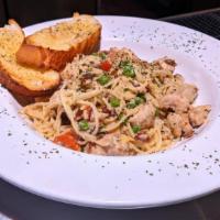 Chicken Carbonara · sauteed with diced tomatoes, bacon & peas