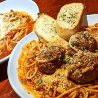 Spaghetti Marinara · with marinara. add 1-4 meatballs  +2.00 ea. [pictured with and without meatball add-on]