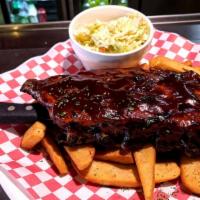 Baby Back Ribs - Half · pork ribs slow-roasted then brushed with our homemade BBQ