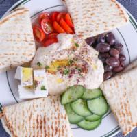 Hummus Plate · Served with kalamata olives, cucumbers, tomatoes, feta cheese and pita bread.
