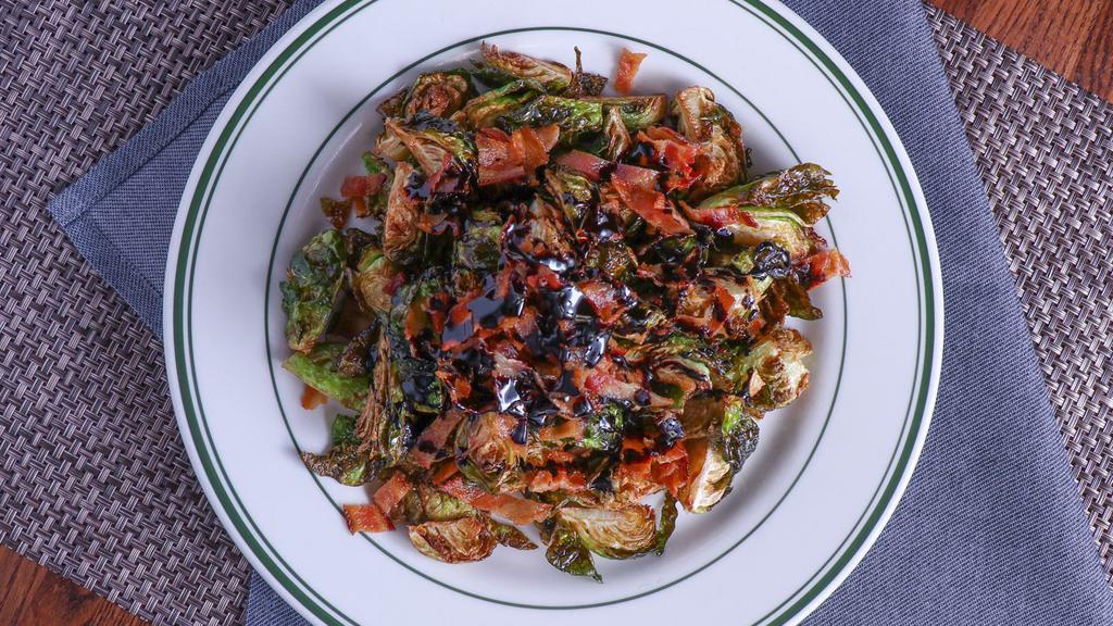 Fried Brussels Sprouts · Tossed with reduced balsamic vinaigrette and bacon bits.