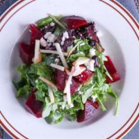 Roasted Beets · Rosted Beets, arugula, apples, feta cheese and passion fruit vinegarette.